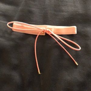 Pink velvet choker with bow. Never worn!